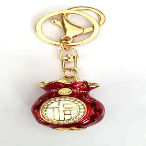 Golden red fortune bag keychain metal rhinestone purse charm lucky key ring pendant gift.