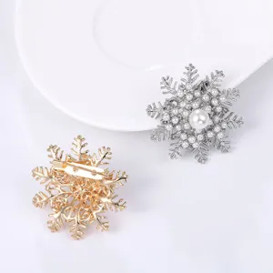 Snowflake pearl brooch detail showcasing exquisite design, elegant pin for sweater and shirt.