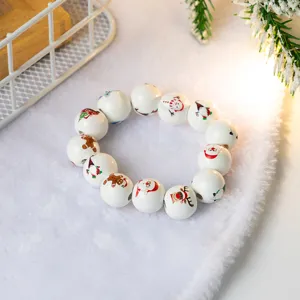 Christmas wooden bead bracelet with cute festive patterns like Santa and snowman, cozy style.
