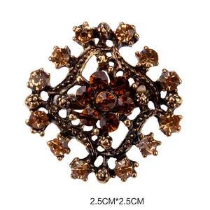 Vintage alloy rhinestone brooch pin detailed closeup showing delicate crystal flower design.