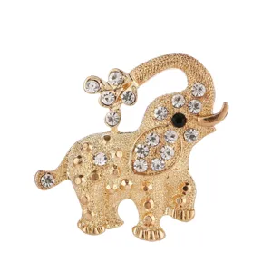 Elegant gold-tone rhinestone elephant brooch pin, sparkling crystal details for apparel.