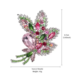 Detailed view of the crystal rhinestone floral brooch, showing sparkling multicolor stones and size.