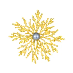 Elegant pearl snowflake brooch, vintage gold coral pin for women coat accessories main view.