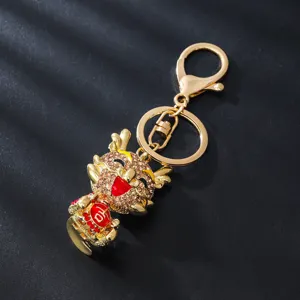 Metal rhinestone cartoon dragon keychain, cute luxury bag pendant and car key ring accessory.