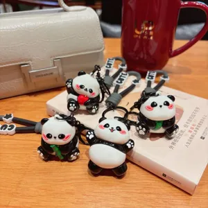 Cute cartoon panda keychain detail view, resin animal bag pendant and car key accessory.