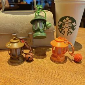 Mini camping lantern keychain with LED light, cute bag charm and creative accessory.