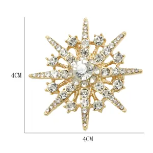 Exquisite rhinestone star brooch pin, elegant gold tone metal fashion clothing accessory for women.