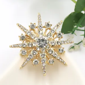Gold tone star crystal rhinestone brooch pin, sparkling starburst lapel pin for women.