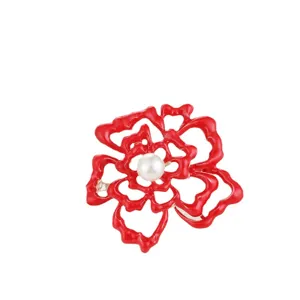 Red camellia flower brooch with central pearl inlay elegant fashion lapel pin accessory.