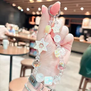 Detailed close-up of a creative acrylic star beaded wrist strap keychain with crystal and pearl beads.