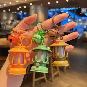 Mini oil lamp keychain with LED night light, cute retro lantern bag pendant, creative gift.