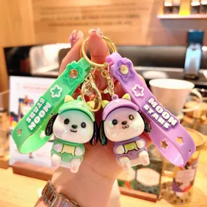 Cute cartoon dog keychain with straps, stylish electroplated bag pendant and car key accessory.