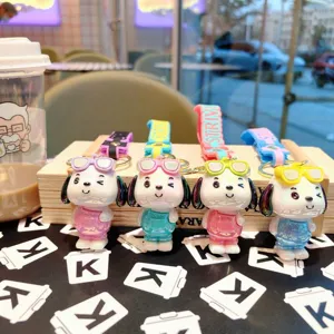 Detailed view of cute electroplated cartoon dog keychains with colorful straps and glasses.