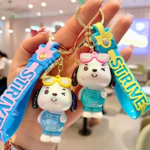 Detail view of cute electroplated cartoon puppy keychain bag pendant with letter strap.