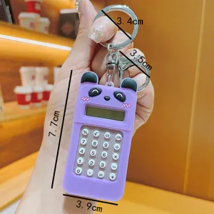 Close-up of the cute cartoon bear mini calculator keychain, portable pendant with clear keys.