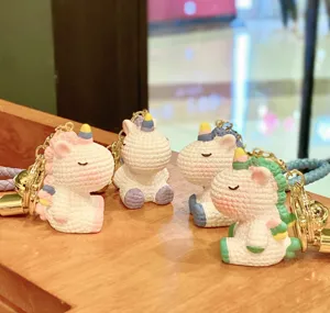 Cute resin rainbow unicorn keychain, colorful bag pendant and car keyring accessory detail.