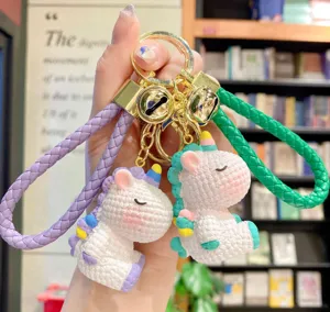 Cute resin rainbow unicorn keychain with braided strap and metal bells, perfect bag pendant.