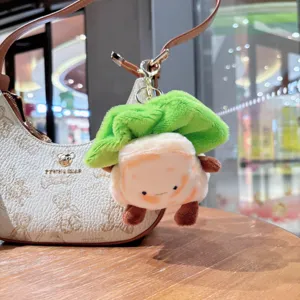 Cute plush food character bag charm keychain dangling from a stylish handbag detail.