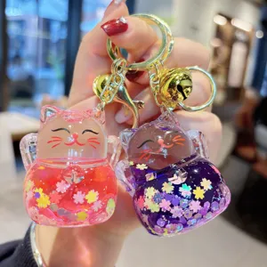 Cute liquid flowing lucky cat keychain, acrylic glitter floating bag charm pendant accessory.