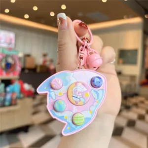 Rosa Cartoon Rakete Spielkonsole Schlüsselanhänger für Kinder süßer Taschenanhänger