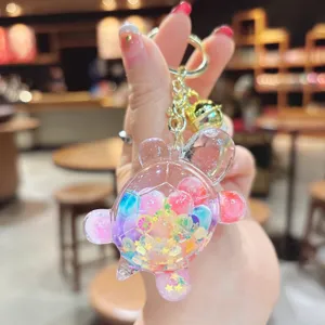 Simpatico portachiavi tartaruga con glitter liquido, ciondolo borsa in resina trasparente.