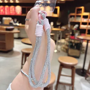 Cinturino da polso per cellulare in strass con cordino rosa, elegante laccetto per smartphone.