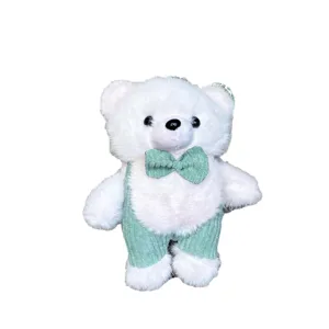 Cute white plush bear keychain with green overalls and bow tie, soft bag pendant doll.