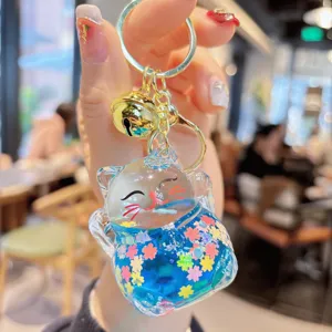 Cute acrylic Maneki-Neko liquid quicksand keychain, sparkling bag pendant charm for car.