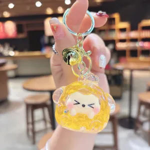 Cute quicksand bling dumpling keychain pendant, sparkling glitter trend toy bag charm for women.