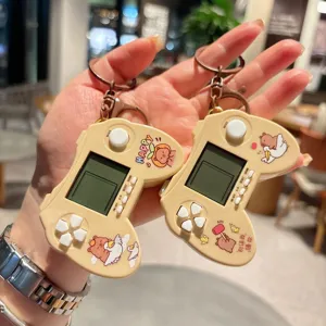 Detailed view of cute capybara handheld game console keychain, portable stress relief toy.