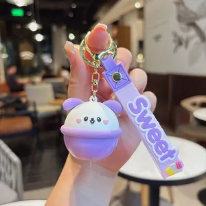 Lindo llavero de cachorro de dibujos animados colgante de bolsa brillante púrpura luz LED