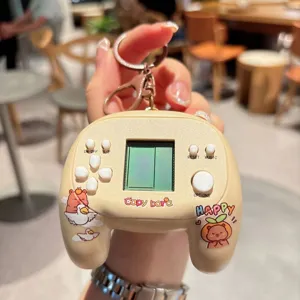Cute capybara electronic game console keychain detail, portable decompression toy pendant.