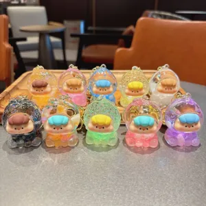 Cute liquid floating charm keychain, transparent capsule fruit doll bag pendant toy.