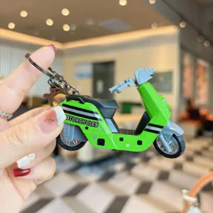 Green scooter keychain miniature detail view alloy vehicle model pendant accessory.
