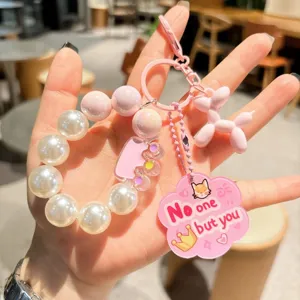 Kreativer Acryl Perlen Schlüsselanhänger mit süßem rosa Ballonhund Anhänger und Perlen.