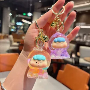 Cute liquid floating bead keychain, trendy doll bag pendant, creative fruit design accessory.