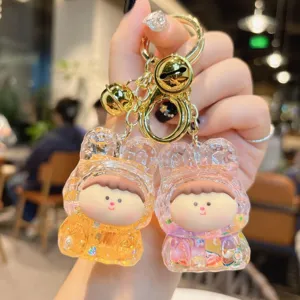 Cute acrylic quicksand keychain pendant with luminous glitter design, perfect gift bag accessory.