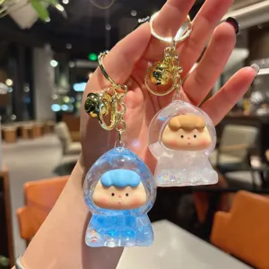 Cute liquid quicksand keychain with floating beads, transparent oil-filled doll bag pendant charm.