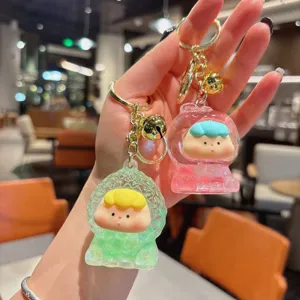 Cute oil-filled liquid keychain cute fruit doll bag pendant stylish acrylic keyring charm.