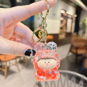 Acrylic quicksand keychain with cute cartoon character pendant, glitter liquid toy bag charm.