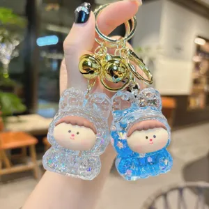 Cute liquid glitter acrylic keychain with metal bell and cute cartoon doll design for bags and keys