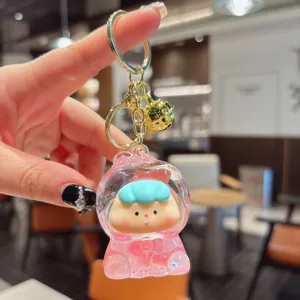 Cute liquid quicksand keychain with a lovely cartoon doll pendant, detailed close-up shot.