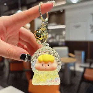 Cute liquid quicksand keychain with floating glitter and adorable cartoon doll pendant for bags.