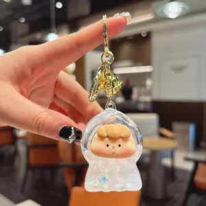Cute liquid glitter keychain featuring an adorable cartoon doll pendant for stylish bag charms.