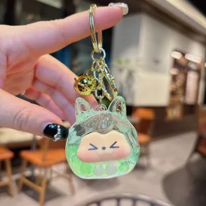 Portachiavi con sabbia movibile carino con campanello e personaggio cartone animato verde.