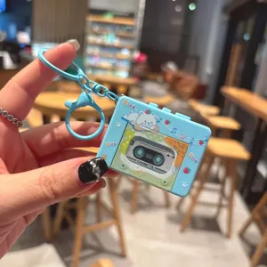 Cute cartoon music player keychain toy, portable stress relief bag pendant and car key accessory.