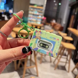Close-up of the retro cassette music player keychain showing cute deer graphic and details.