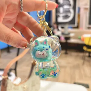 Cute liquid quicksand bear keychain detail, clear acrylic design with sparkly floating glitter.