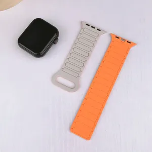 Replacement silicone magnetic watch band compatible with smartwatches, grey and orange.