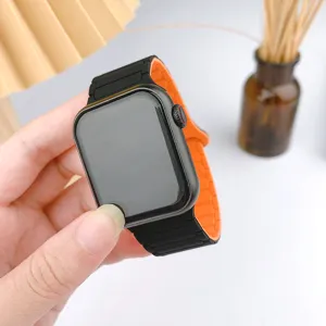 Silicone magnetic watch strap compatible with Apple Watch, black and orange three-bead design.